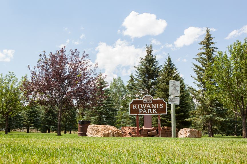 Kiwanis park sign in front of trees