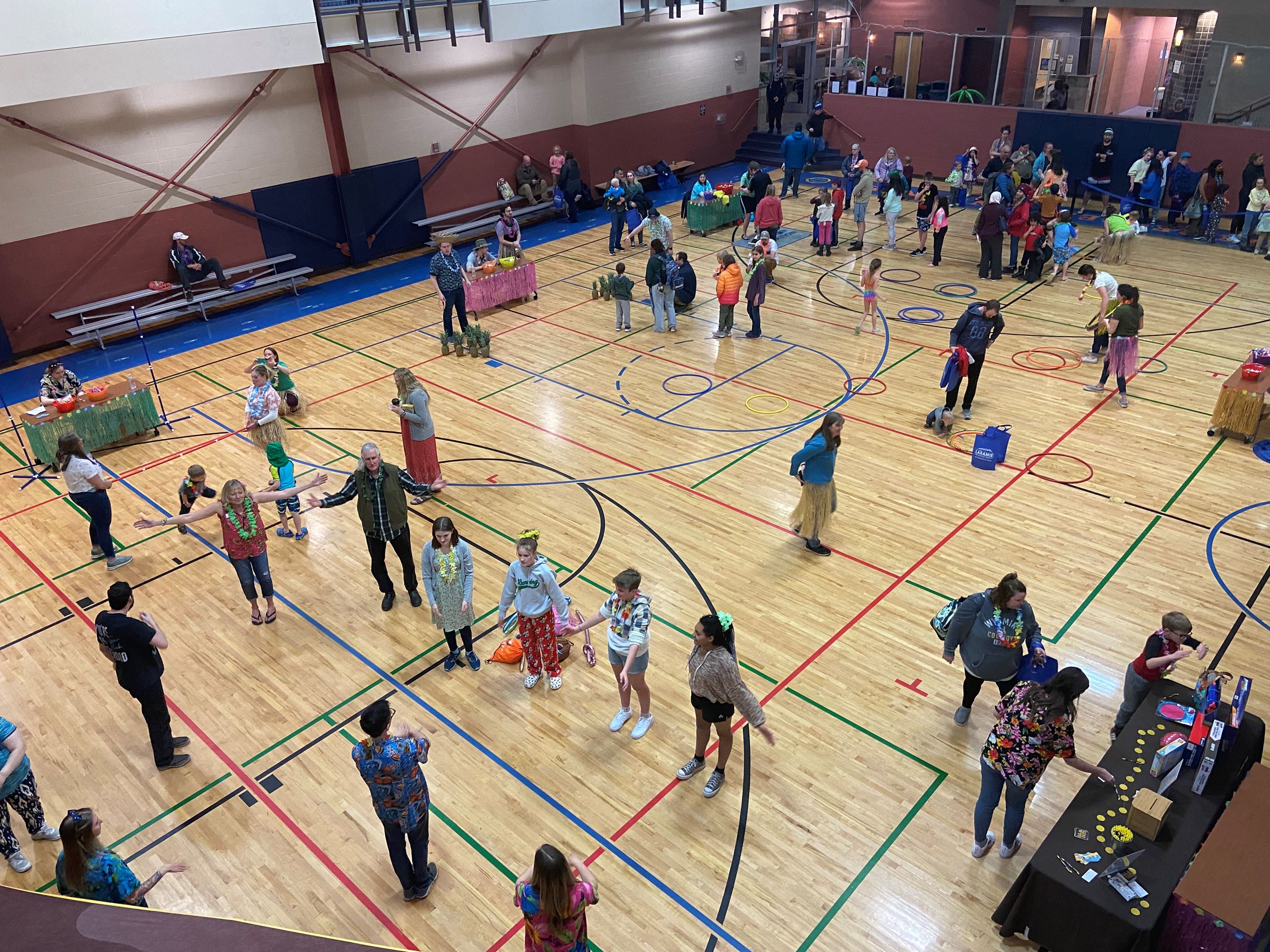 people in a gym at Luau in Laradise